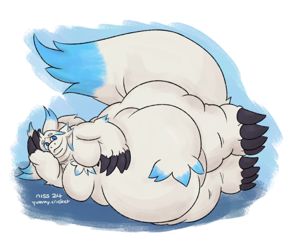 a very fat white and blue fuzzy dragon laying on his side